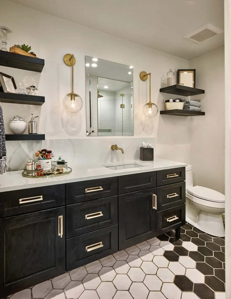 Guest bathroom with black vanity, brass fixtures, and geometric tile flooring in Buena Vista