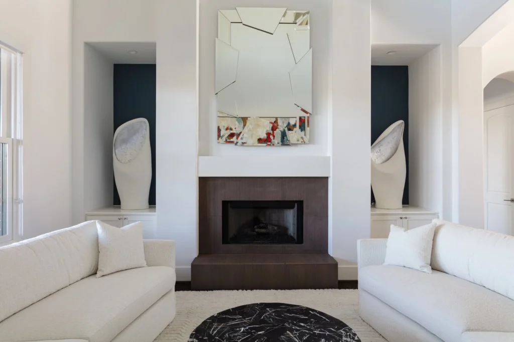 Light-filled living room with modern fireplace and sculptural decor in the Light House remodel